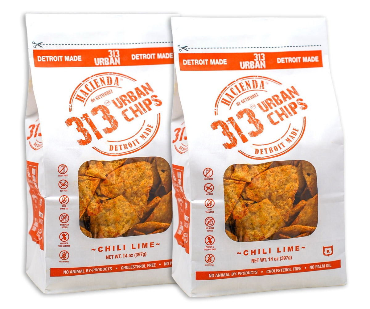 Two bags of 313 Urban Chips featuring a Chili Lime flavor, each bag labeled &quot;313 Urban Chips,&quot; with details emphasizing they are &quot;Detroit Made&quot; and showcasing the crispy chips inside the transparent window.